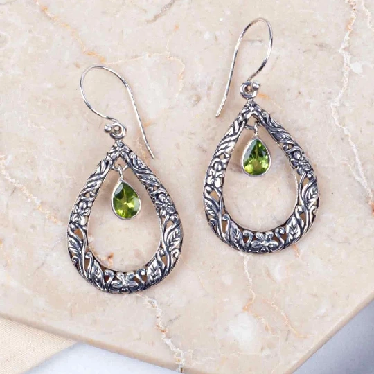 silver earing with peridot